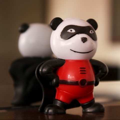 ZuPanda superhero version, a plastcica panda in a red jumpsuit