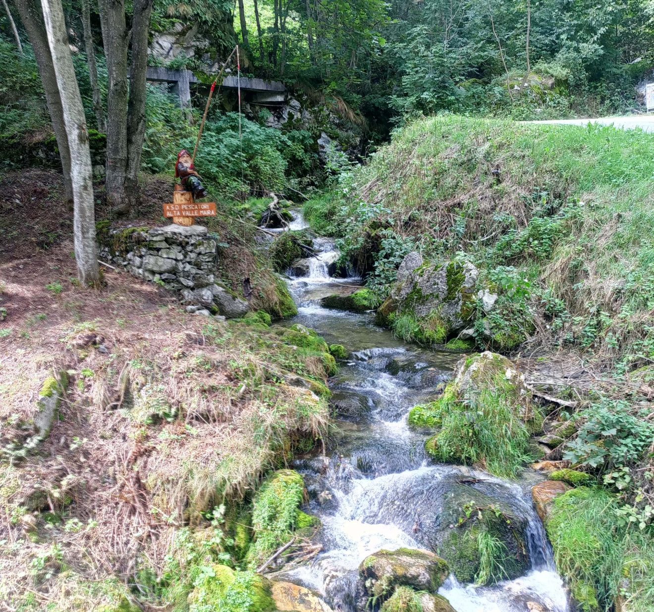 The gnomes path: discovering the Maira Valley - At the mouth of the dirt path a beautiful old mill makes a fine display, but more importantly a beautiful fishing gnome