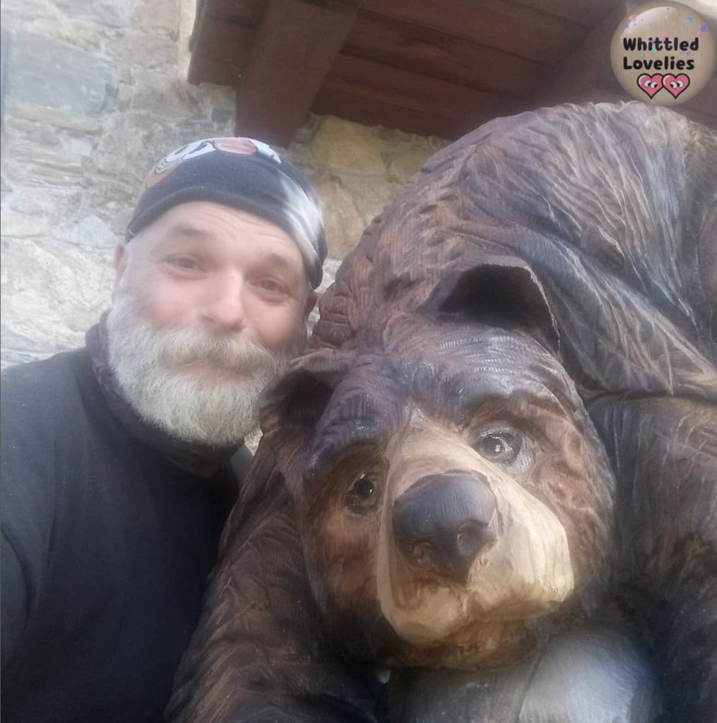 Barba Brisiu: an Italian chainsaw carver - Photo of Barba Brisiu with bear of his own creation - from his Instagram profile