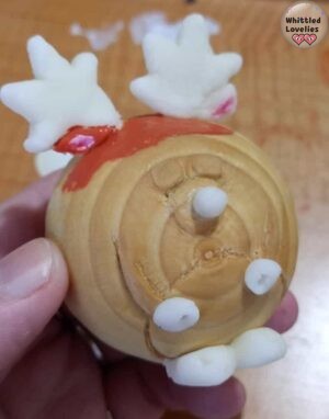 The ball with the 3d cold porcelain elements applied. The color remains the same and uniform on both porcelain and wood.