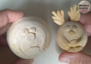Here are the two balls compared, the big one has only light cuts and hinted shapes, the 3d elements will be made with cold porcelain. The small one, on the other hand, is completely hand-carved including the 3d elements.