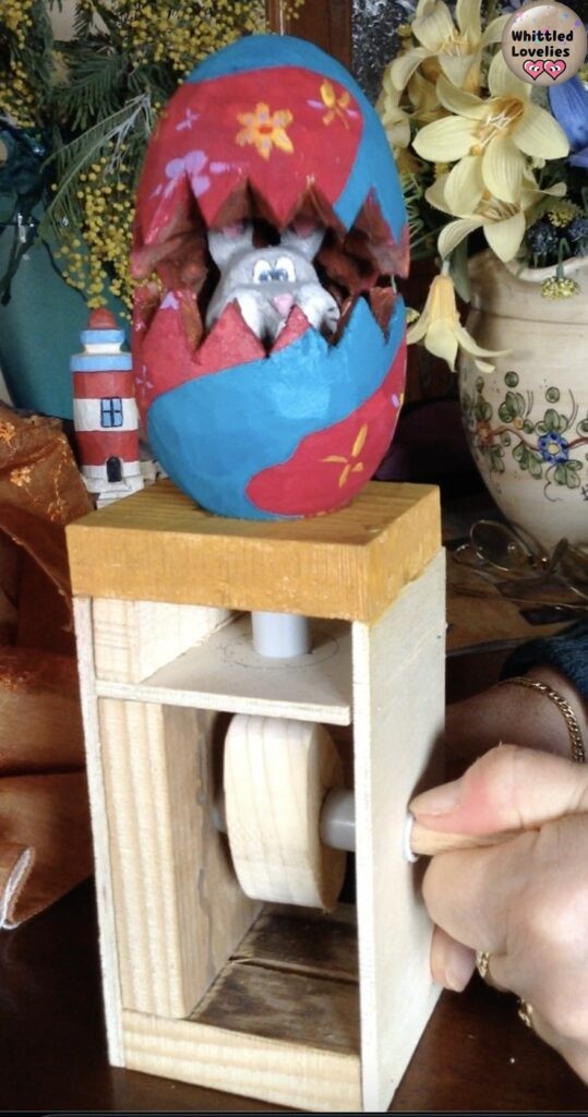 Easter decor: the mechanized wooden easter egg - finished project, egg applied on the mechanism turret and rabbit peeking out